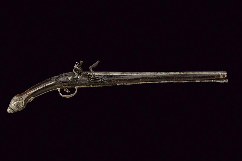 Pistola a pietra focaia con fornimenti in argento